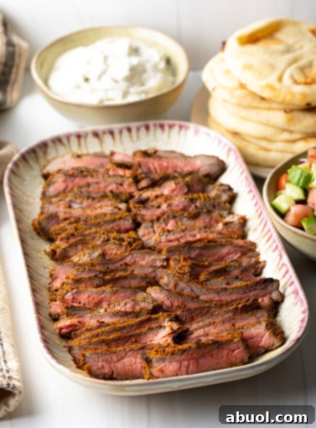 Savory Spiced Beef Shawarma 4 Side view platter with strips of steak shawarma.