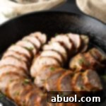 Cooked honey garlic pork tenderloin out from roasted. Chops sliced in cast iron skillet.