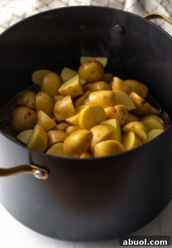 Chopped raw potatoes in the pot.