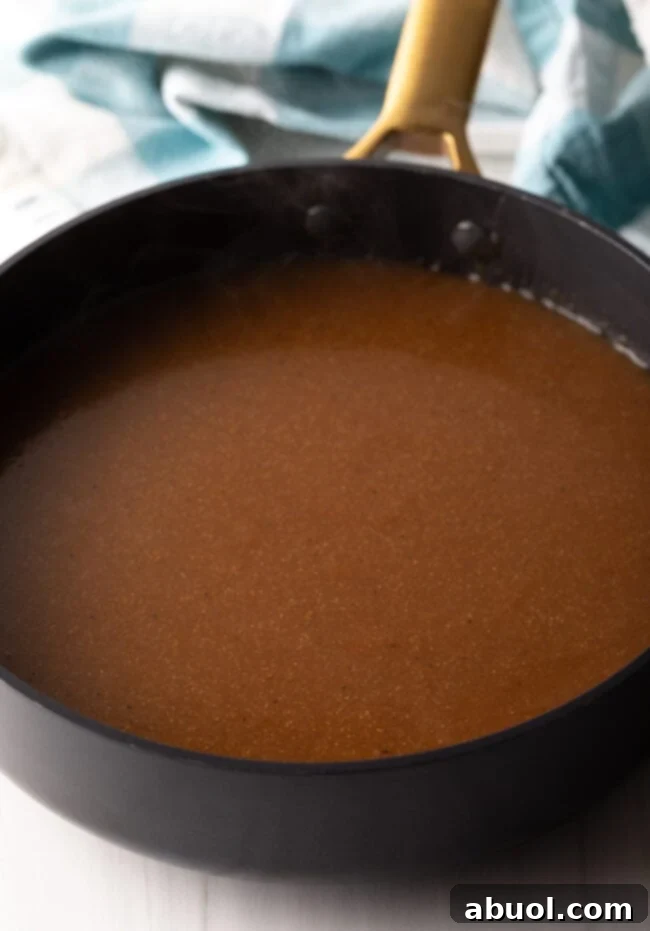 Delicious Homemade Beef Gravy 8 Homemade brown beef gravy in a deep black skillet.