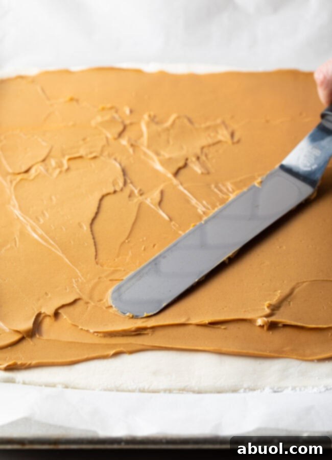 Spreading peanut butter across