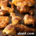Smoked poultry pieces on a cutting board.