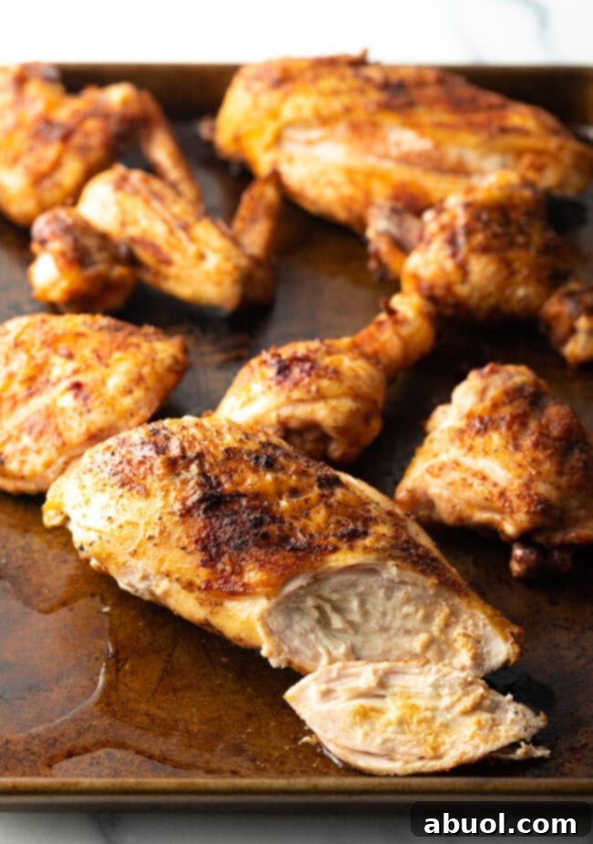 Smoked poultry pieces on a cutting board.