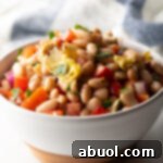 Vibrant Artichoke White Bean Delight 12 White bowl brimming with Artichoke White Bean Salad.
