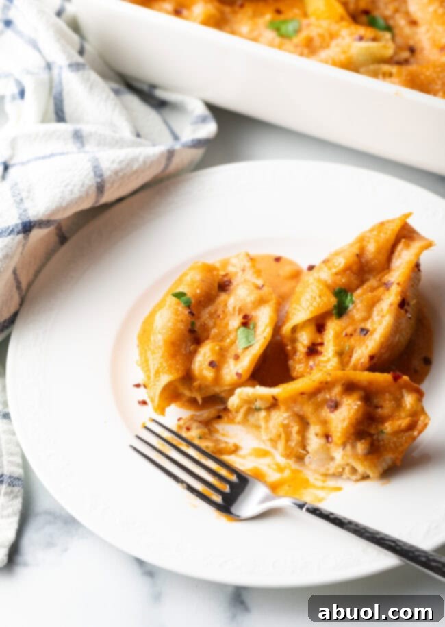 A close-up shot of the perfectly baked and golden seafood stuffed shells, ready to be served.