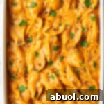 Top down view baked stuffed shells seafood pasta.
