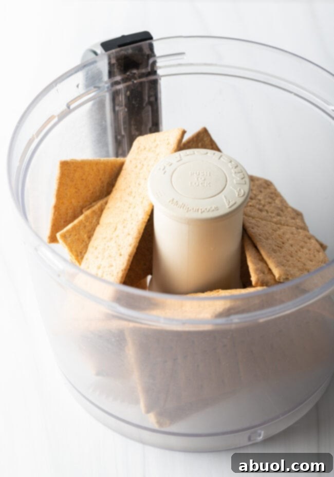 Several sheets of graham crackers in a food processor.