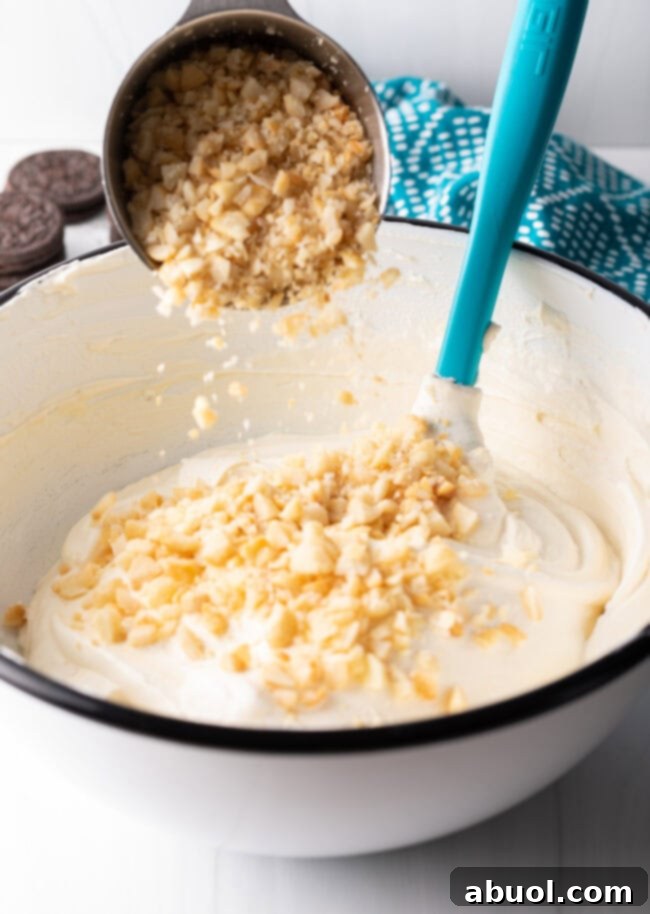 A mixing bowl filled with freshly whipped heavy cream, showcasing stiff peaks.