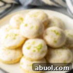 White plate piled with glazed key lime cookies.