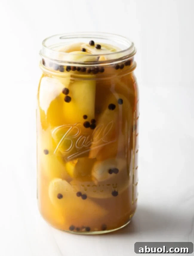 Pickled Green Tomatoes in jar with spices