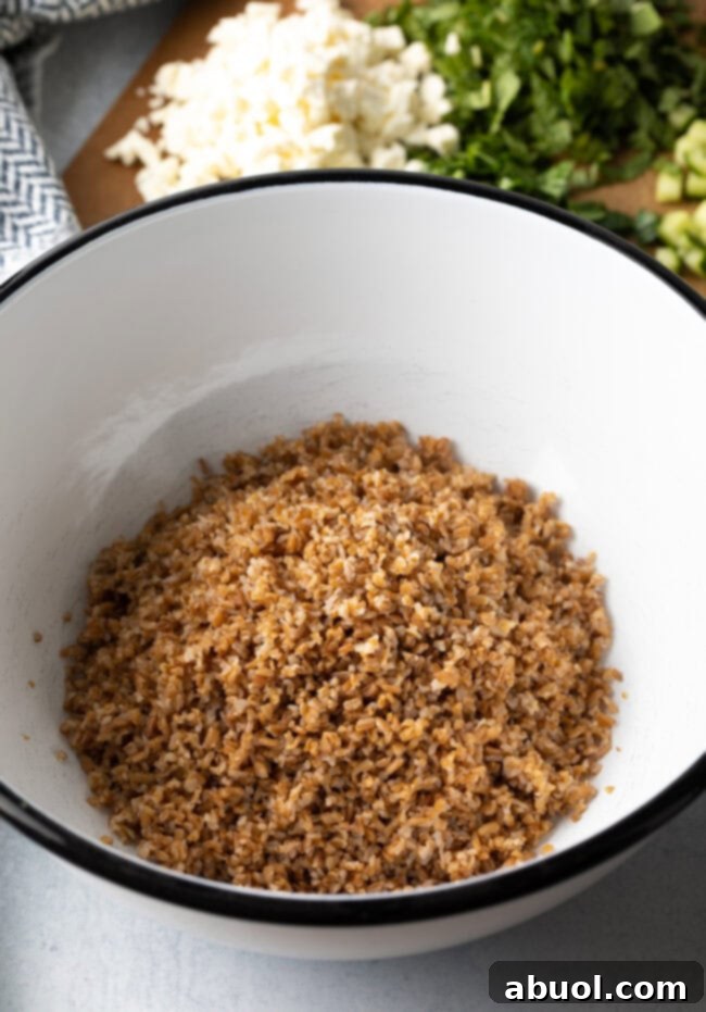 Large white salad bowl with cooked bulgar wheat.