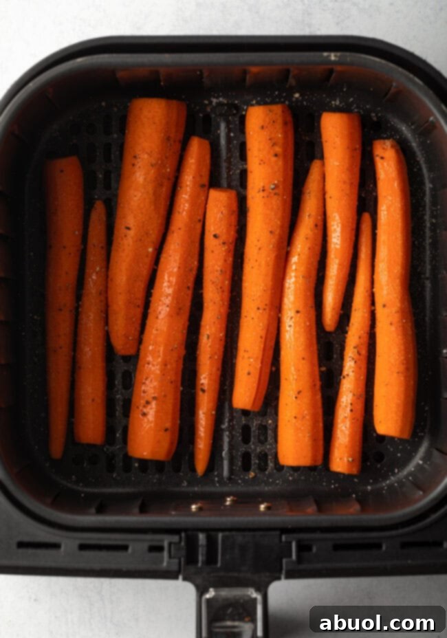 Whole raw carrots in the basket.