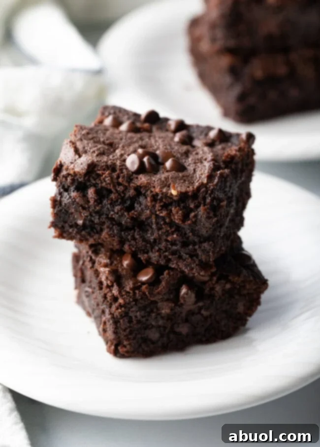 Power & Glow Collagen Brownies 3 A close-up shot of a single fudgy protein brownie, highlighting its rich, moist interior.