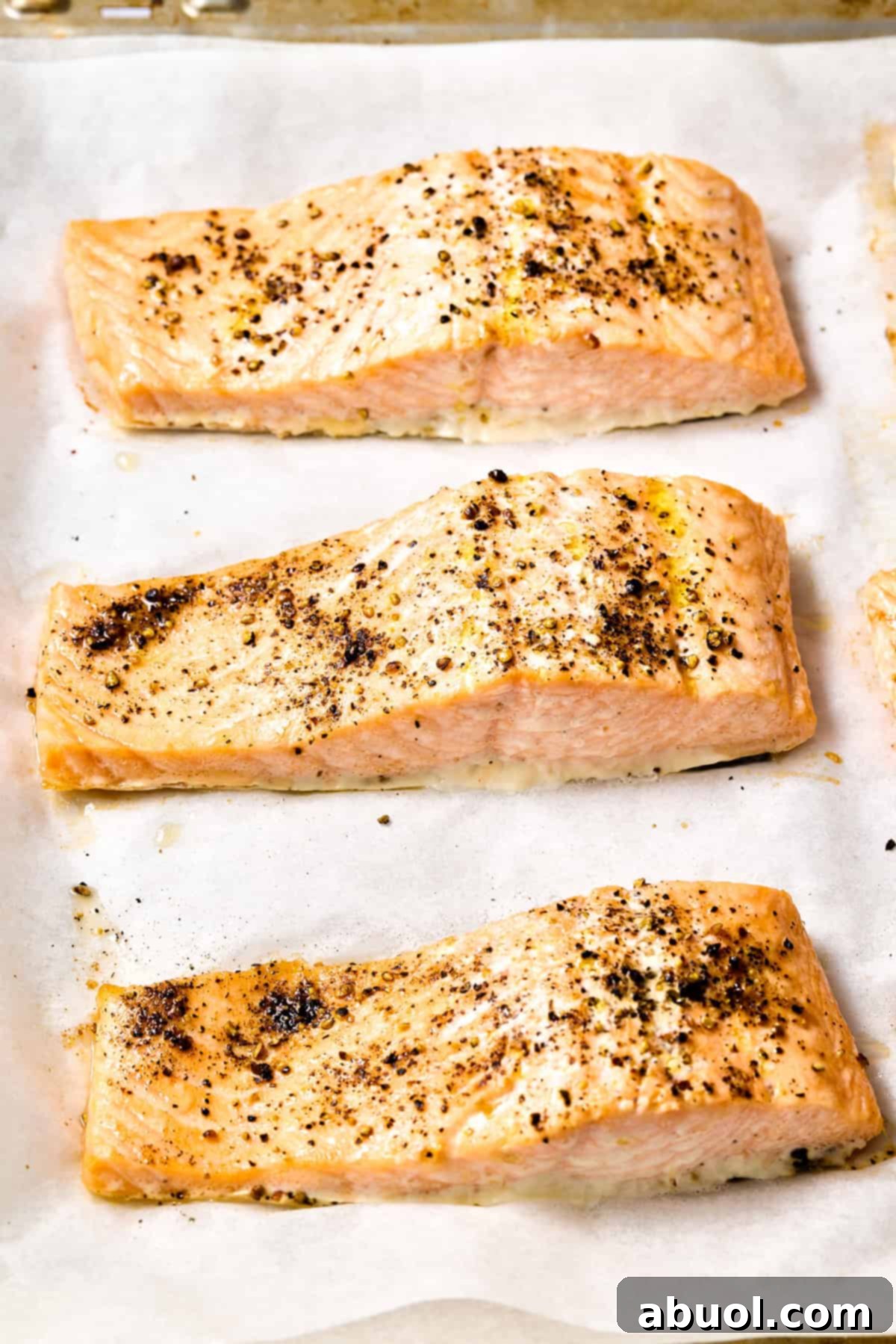 Roasted salmon on baking sheet - fresh out of the oven