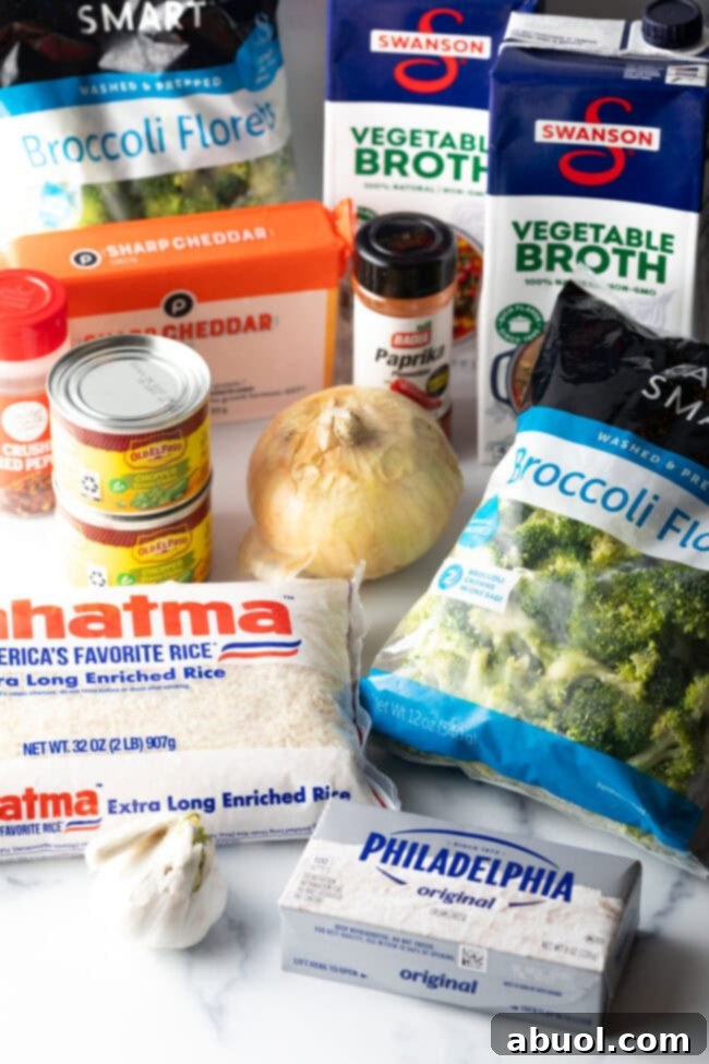 Recipe ingredients in packages: broccoli, rice, cream cheese, mild chiles, vegetable broth, plus a whole onion.