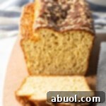Loaf of bread, one piece sliced to show inside of the loaf.