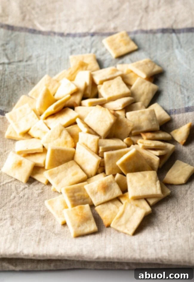 Pile of communion bread cut into small squares.
