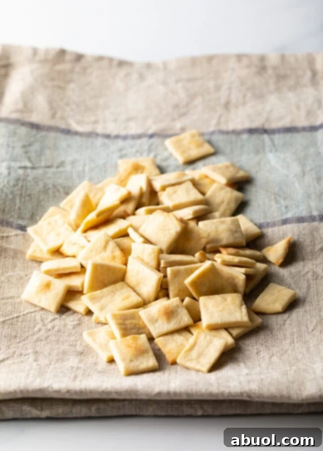 Pile of communion bread cut into small squares.