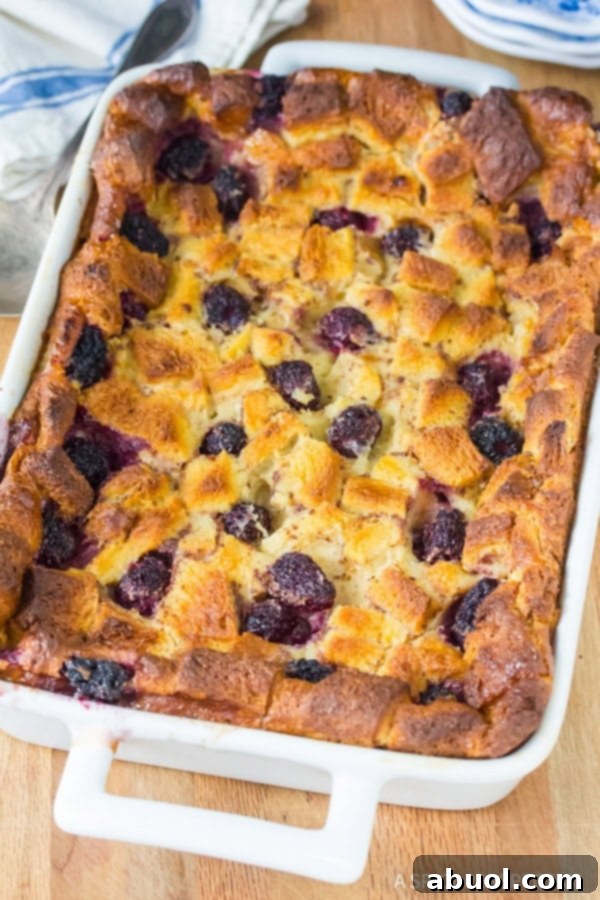 Blackberry bread pudding in a baking dish after being baked. 