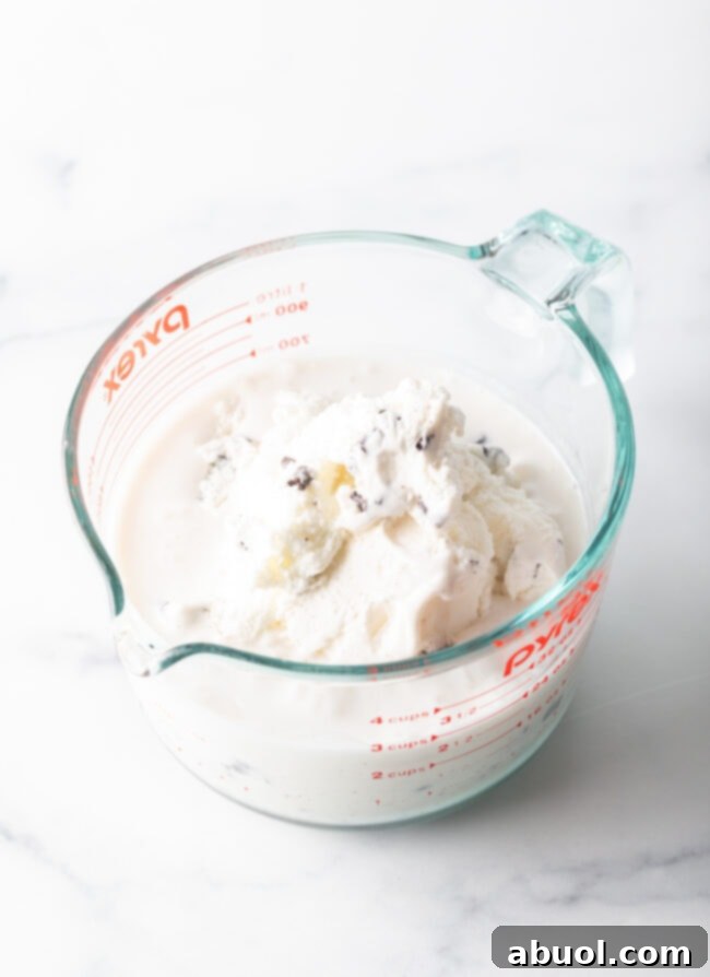 Easy 3-Ingredient Ice Cream Bread 6 Ice cream melting in a large glass measuring bowl.
