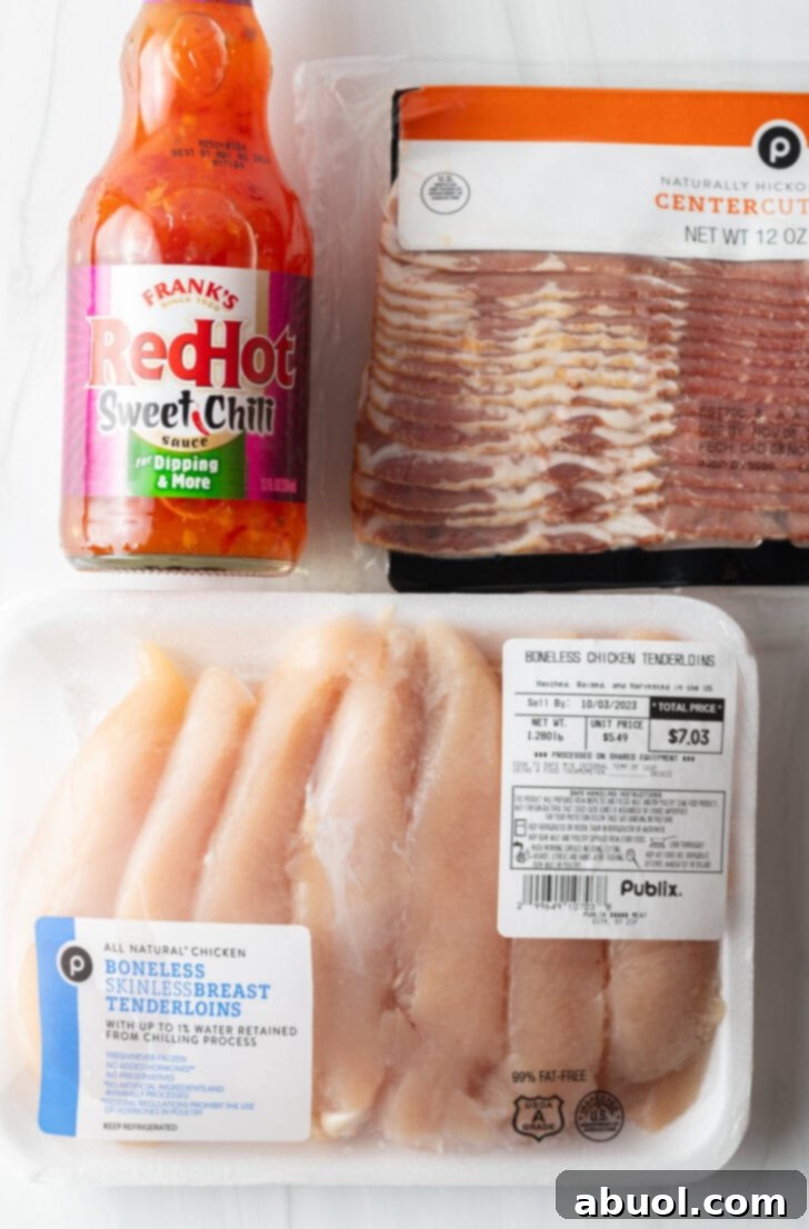 Mouthwatering Bacon-Wrapped Chicken 4 Recipe ingredients: Package of raw chicken breast tenders, sliced bacon, and bottle of Frank's Sweet Chili sauce.