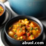 Black bowl with veggie stew.