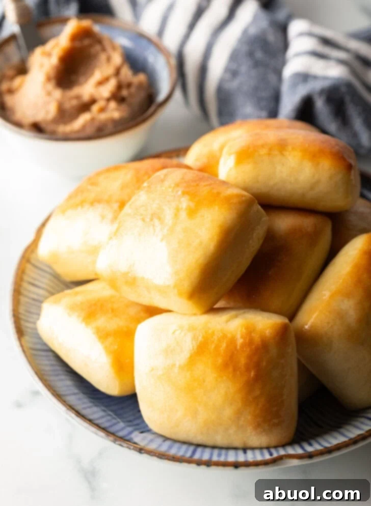 Stack of rectangle Texas Roadhouse rolls.