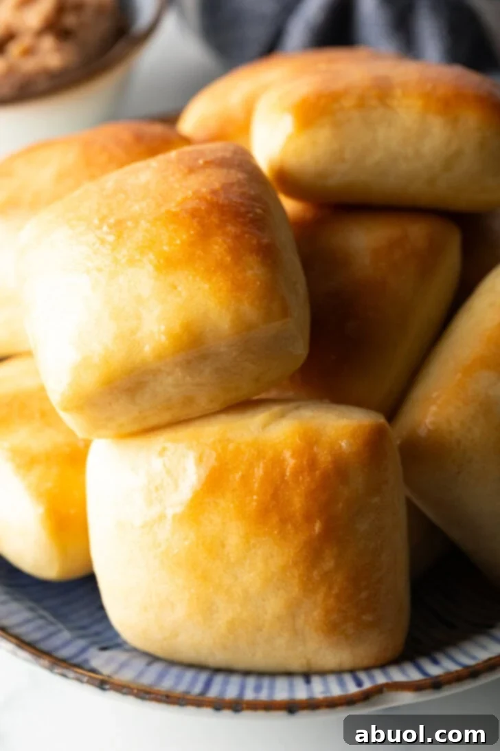 Stack of rectangle Texas Roadhouse rolls.