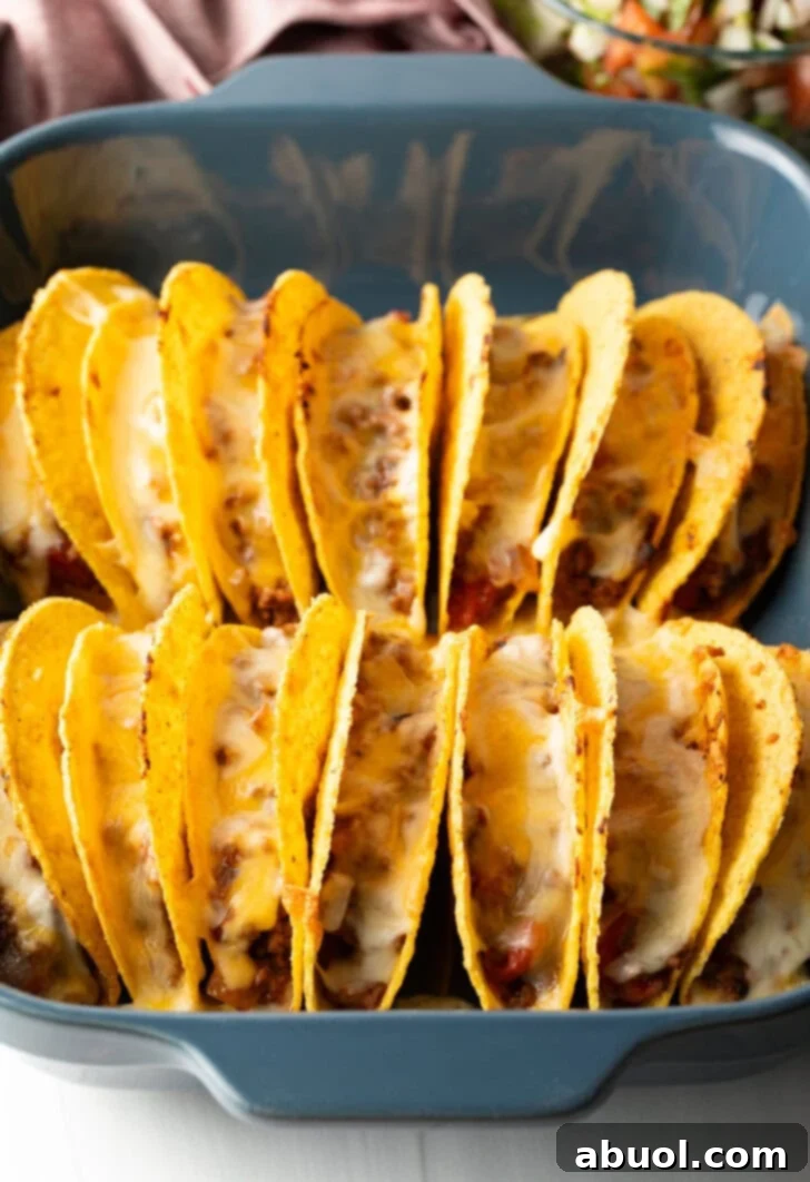 Cheese melted in the rows of tacos.
