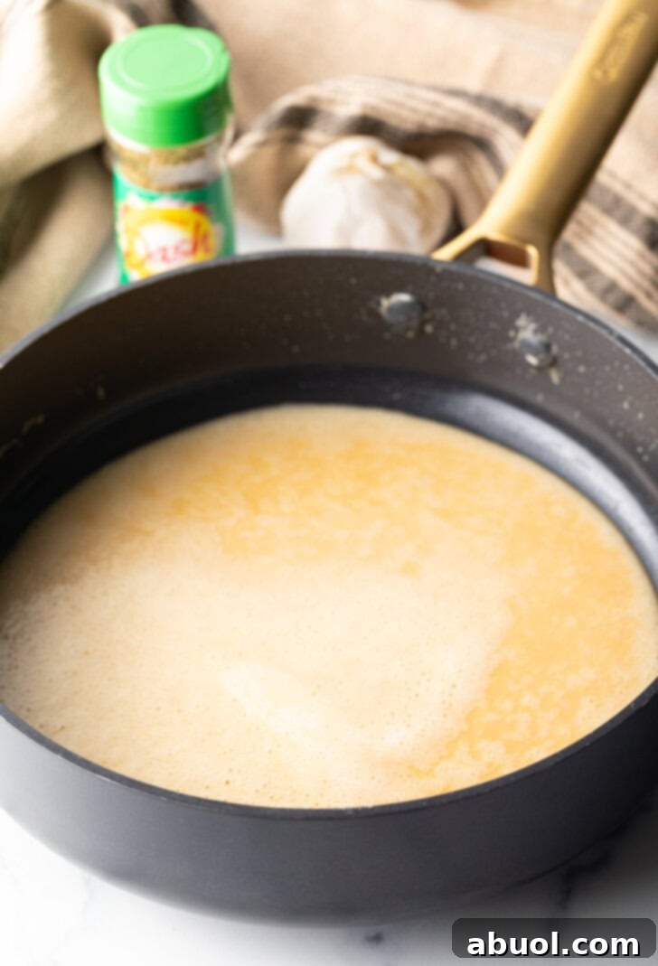 Deep skillet with sauce roux.