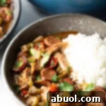 Louisiana Classic Gumbo 12 A small image of a bowl of chicken and sausage gumbo with white rice.