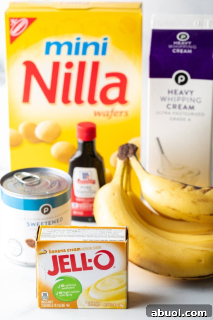 No-Churn Banana Pudding Dream 4 Recipe ingredients: box of nilla wafers, banana pudding, heavy cream, bottle of vanilla extra, can of condensed milk, and bunch of ripe bananas.