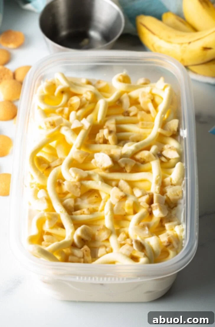 No-Churn Banana Pudding Dream 8 Sections of banana in a rectangle container.