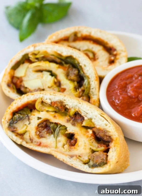 A perfectly baked, golden-brown Stromboli on a baking sheet, ready to be sliced, showcasing its enticing crust.