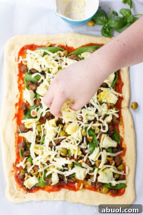 A step-by-step image showing the Stromboli log being brushed with melted butter and sprinkled with pepper before baking.