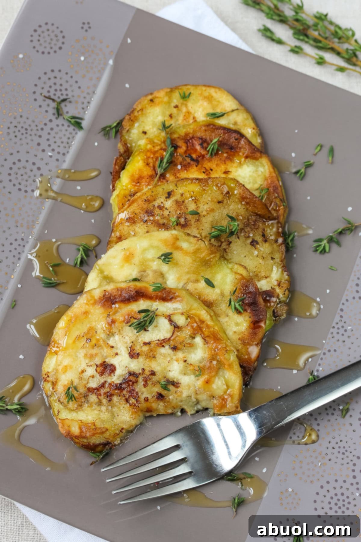 Sautéed Eggplant with Honey and Thyme - Melt-in-your-mouth tender and savory-sweet recipe. A sure fire way to create eggplant converts.