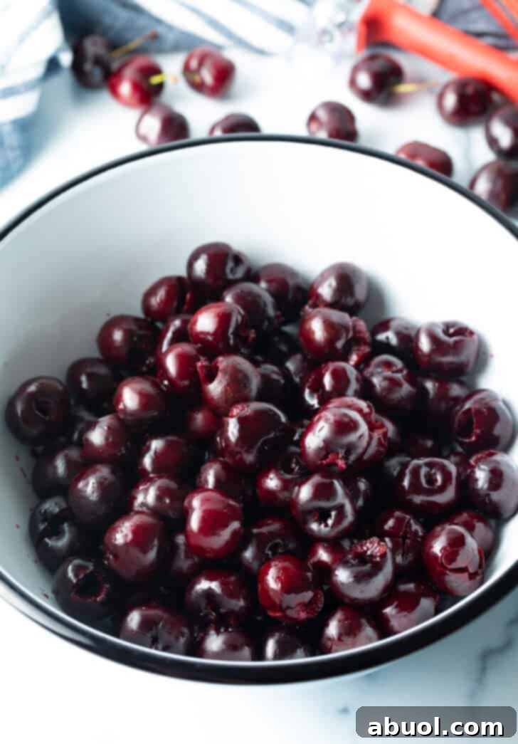 Fresh cherries in a white bowl.