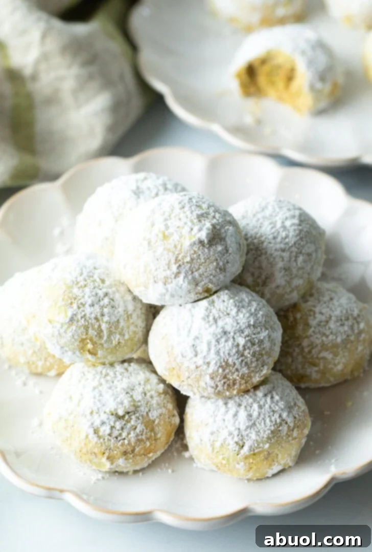 Sweet Italian Bridal Bites 2 Pyramid stacks of almond and pistachio Italian wedding cookies dusted with powdered sugar.