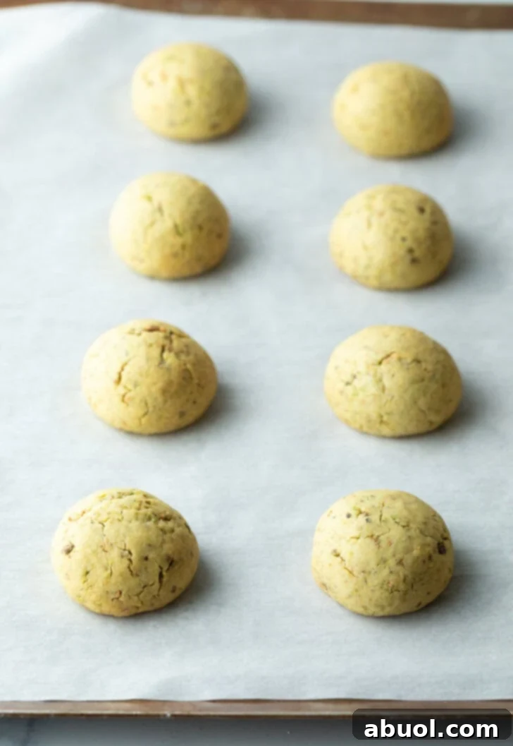 Sweet Italian Bridal Bites 8 Eight balls of baked cookie dough on a baking sheet, golden around the edges.
