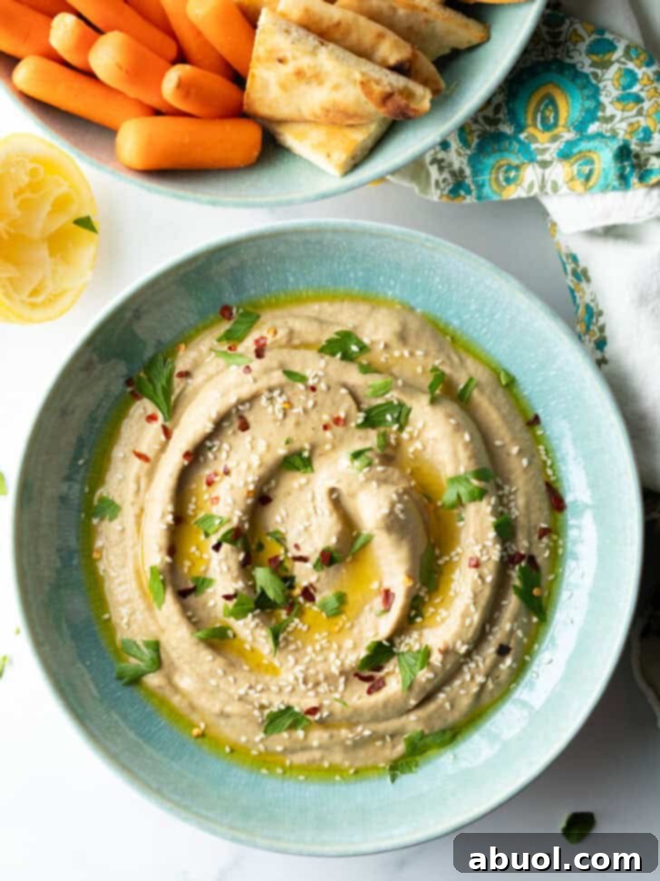 Top down view light blue bowl of baba ghanoush.