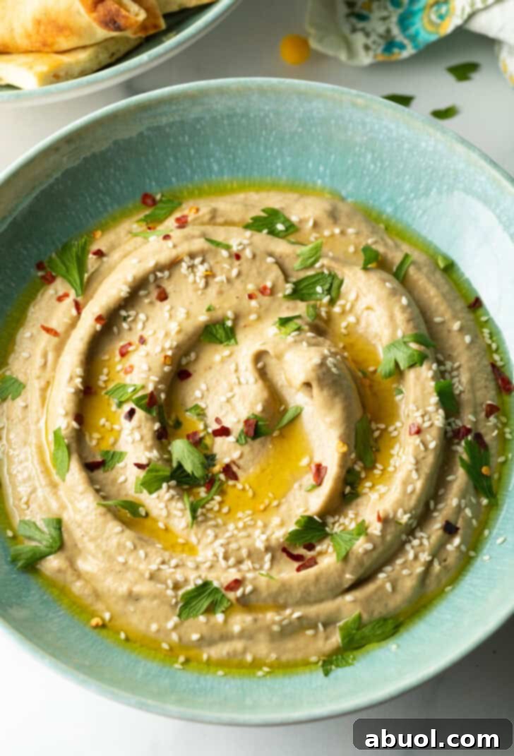 Top down view light blue bowl of baba ghanoush.