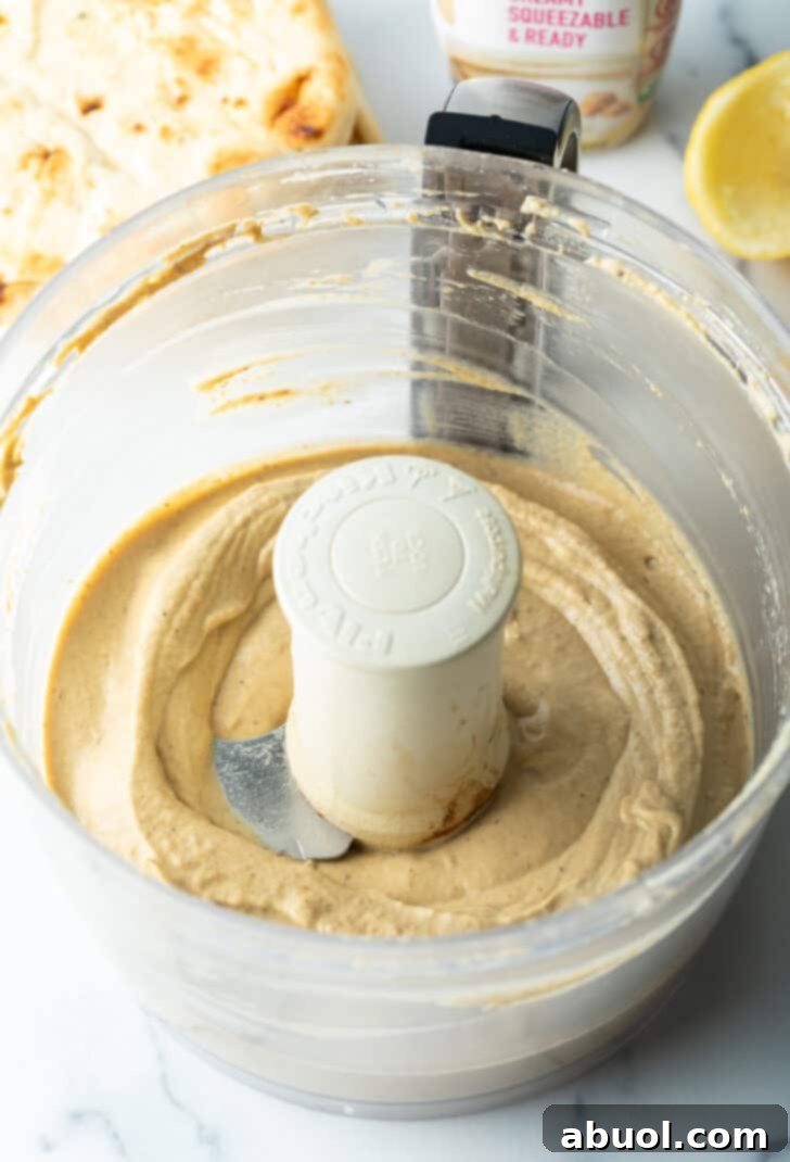 Smooth pureed eggplant dip in a food proceesor.