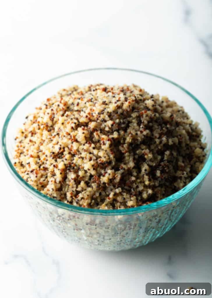 Glass bowl of fluffy quinoa.
