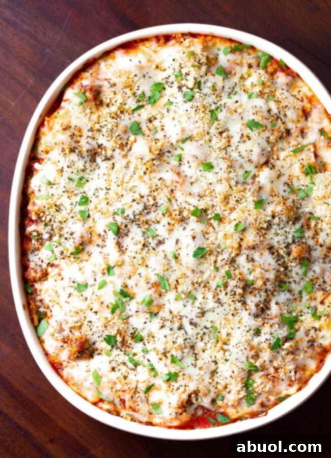 Cream cheese lasagna in baking pan, captured from an overhead angle.