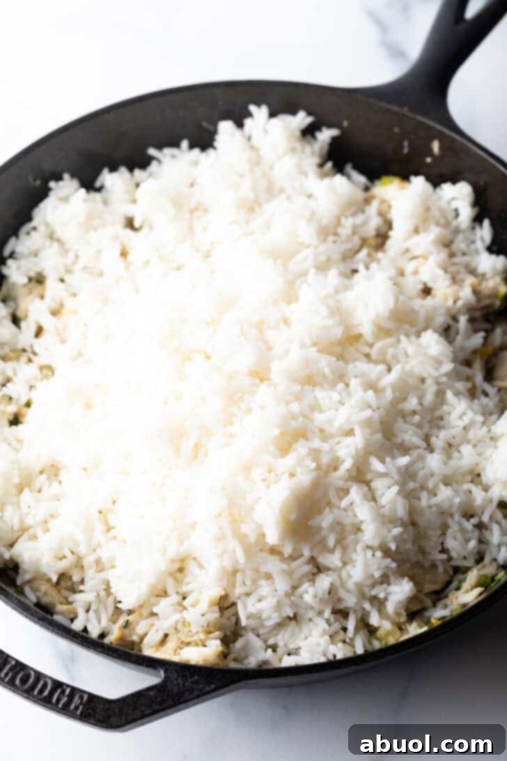 Fragrant Thai Crab Fried Rice 8 Cooked white rice in a black cast iron skillet.