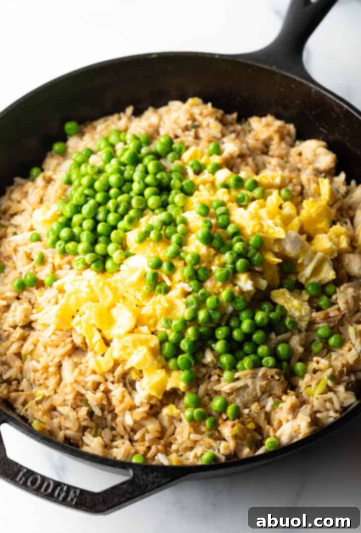 Fragrant Thai Crab Fried Rice 9 Rice and crab topped with peas.