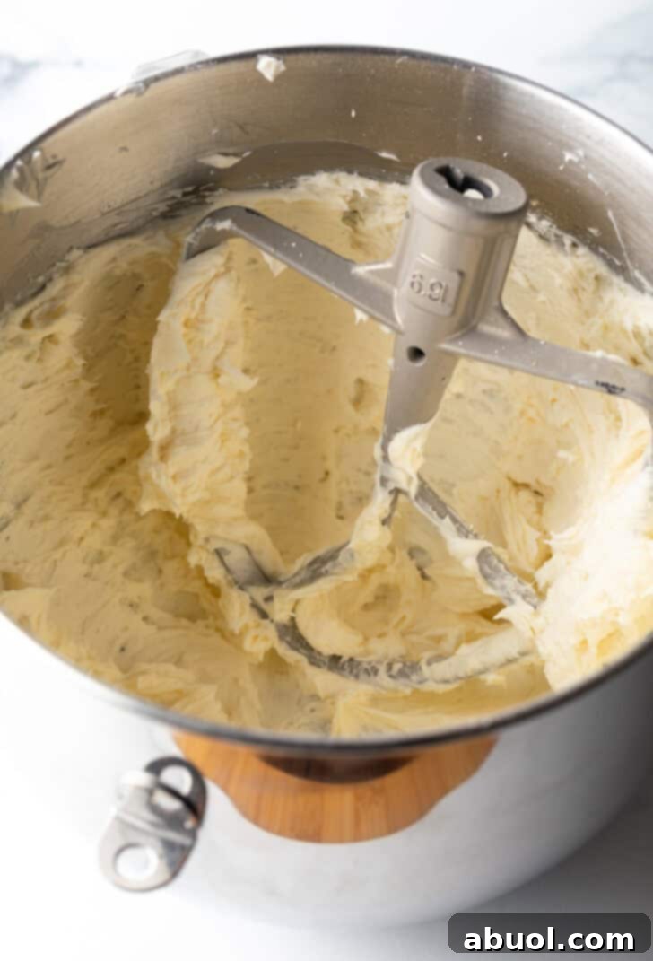 Cornbread cookie dough in a metal standing mixer bowl.