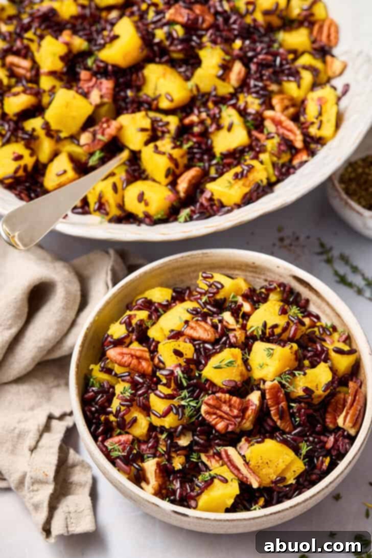 An inviting plate of easy black rice recipe, perfect for fall, garnished with fresh herbs.