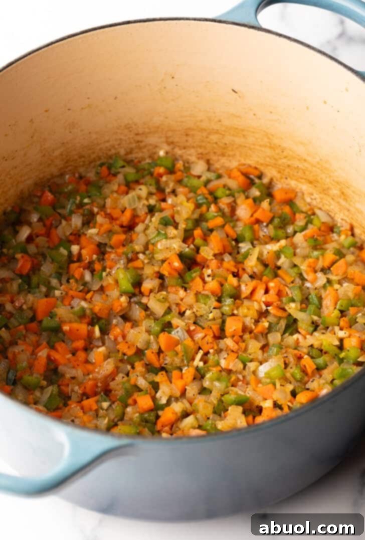 Large pot with chopped sauteed veggies.