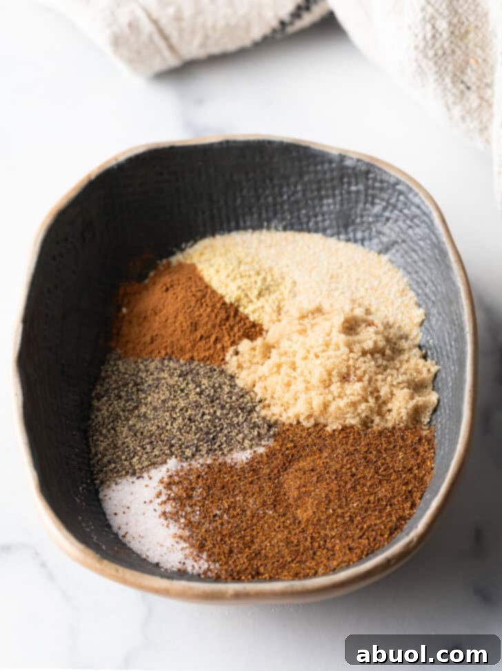Oval bowl with different spices in piles.